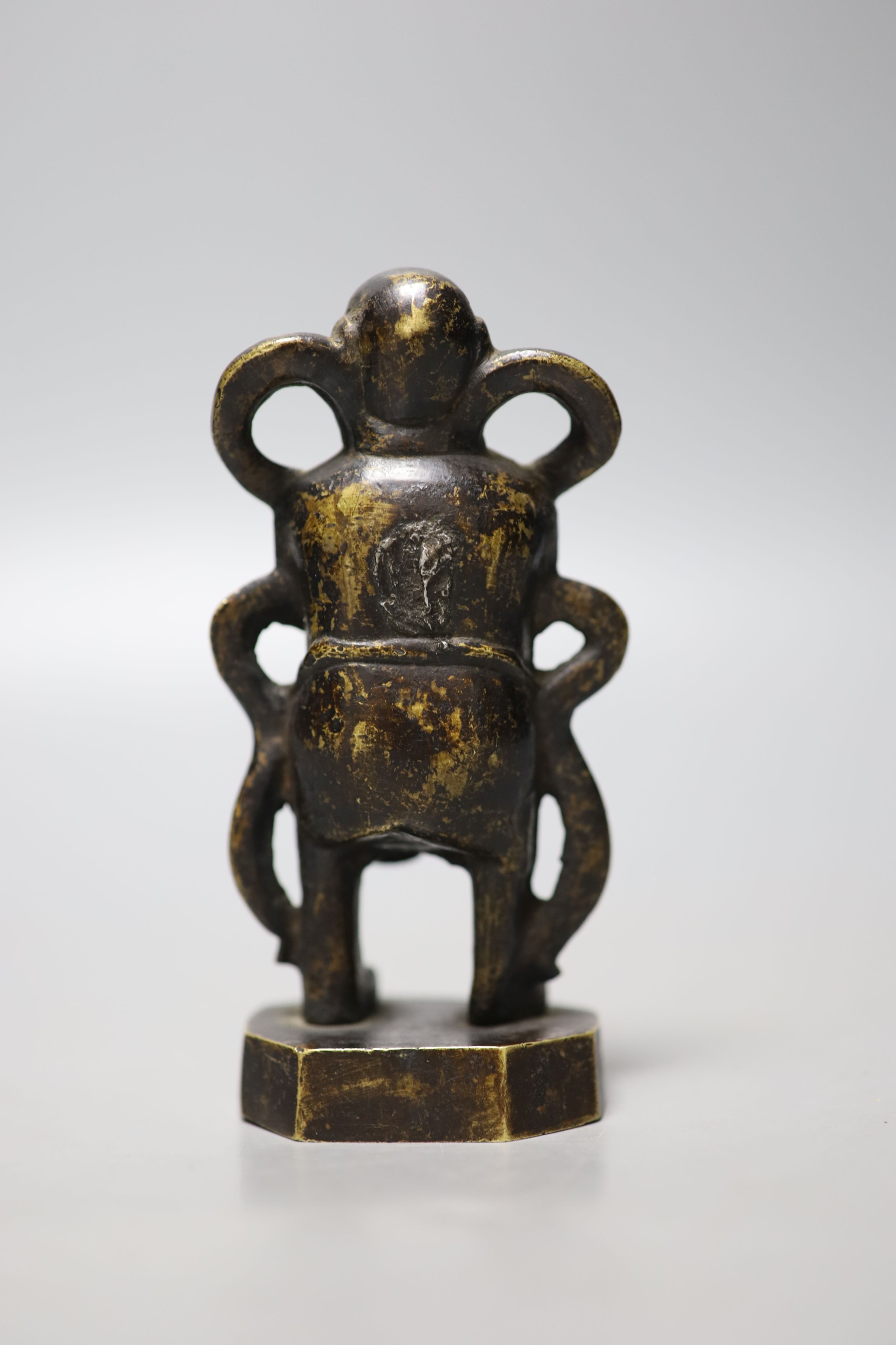 A 19th century Chinese bronze figure of a boy, 12cm